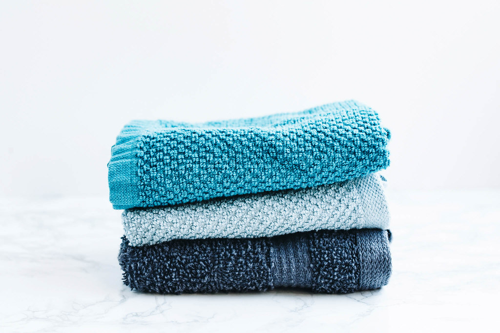 "Set of three bath towels on white background" by wuestenigel is licensed under CC BY 2.0. To view a copy of this license, visit https://creativecommons.org/licenses/by/2.0/?ref=openverse&atype=rich
